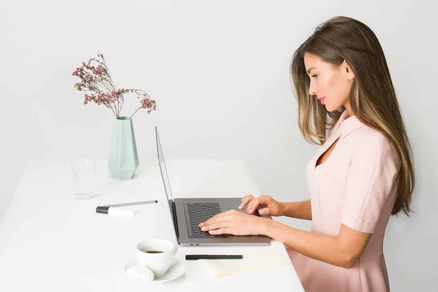 Woman sitting while using laptop